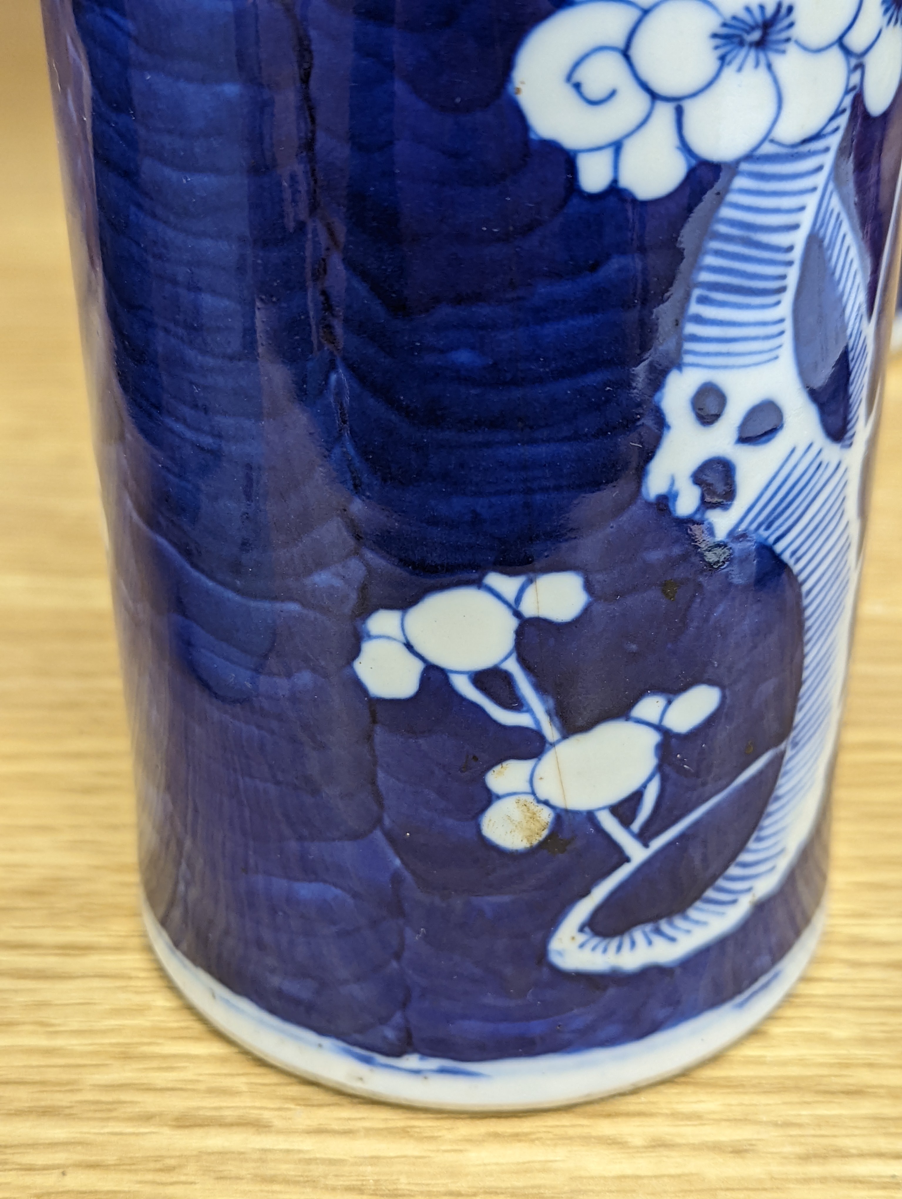 An 18th century Chinese famille rose mug, a Chinese Imari tea caddy and two Chinese blue and white sleeve vases 30cm (4)